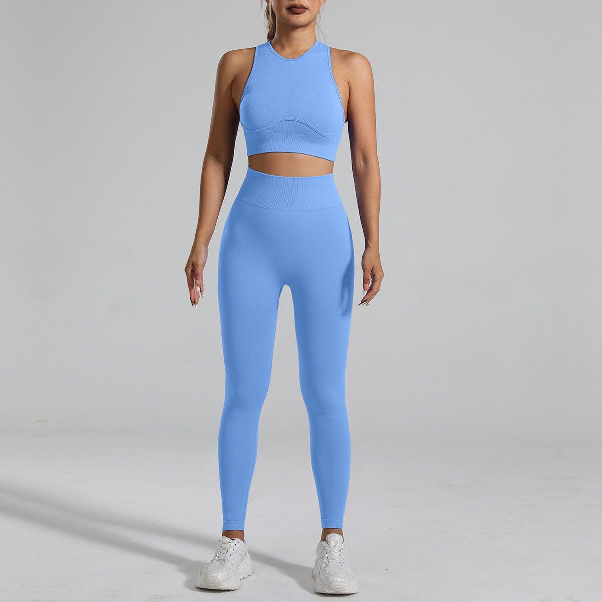 A woman figure, wearing a Light Blue Tight-Fitting Yoga Set